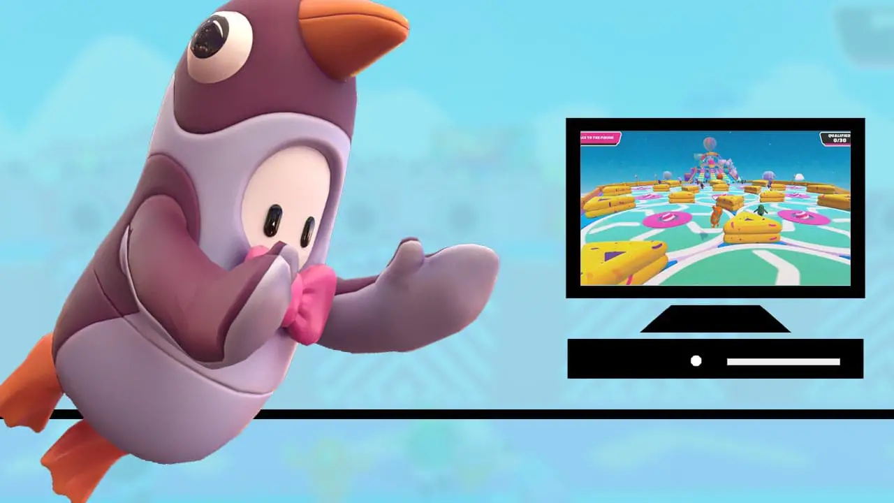 A person in a penguin suit jumping at a desktop pc and monitor