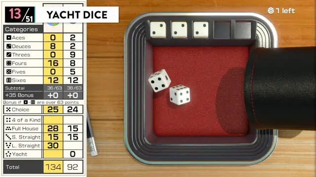 A game of yacht dice represented by a cup spilling dice into a small container with a score card to the left of the screen
