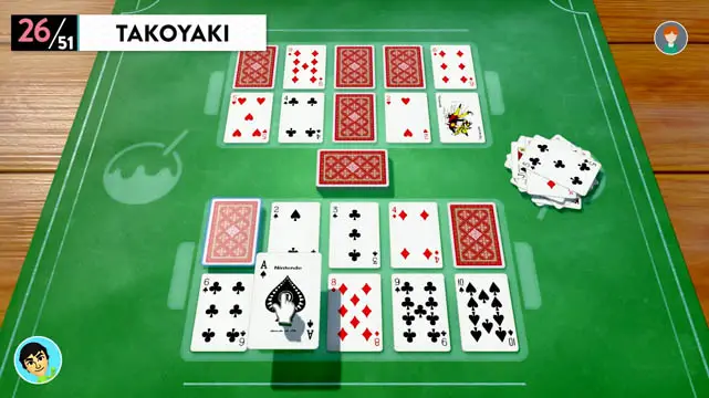 Playing Cards placed on a green table top in a game of Takoyaki