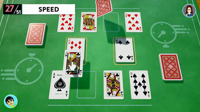 Playing cards set on a table in a game of Speed