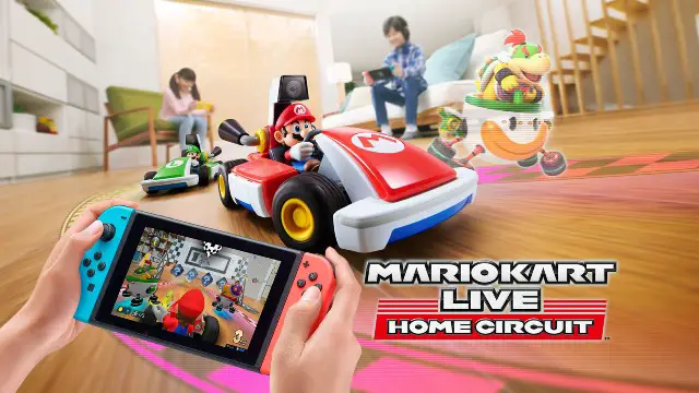 A family playing with real Mario Karts in a living room controlled by a Nintendo Switch