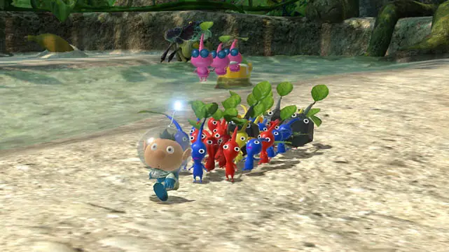 Small man with colorful Pikmin following him next to water