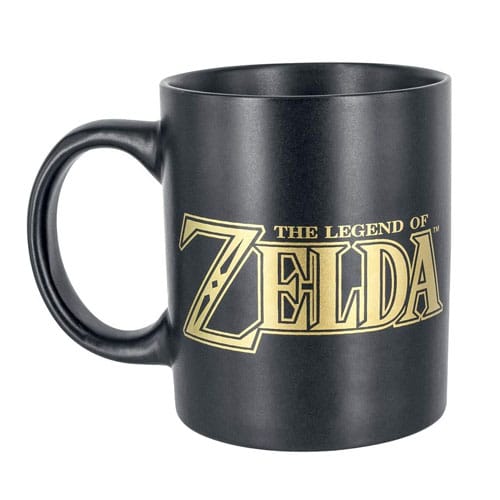 A black Zelda mug with the Zelda logo on it