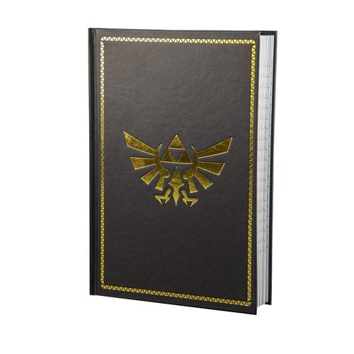 A black notebook with a Zelda emblem on the front cover