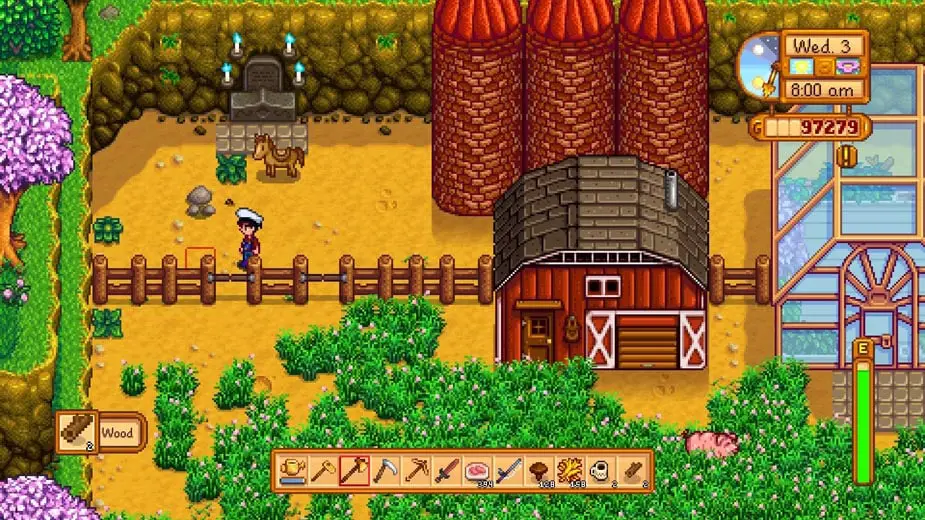 Man on his farm next to his silos