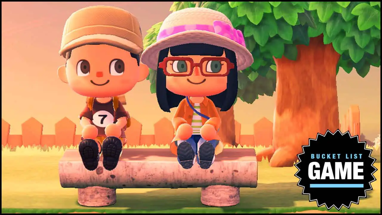 A boy and girl happily sitting on a bench in front of a tree