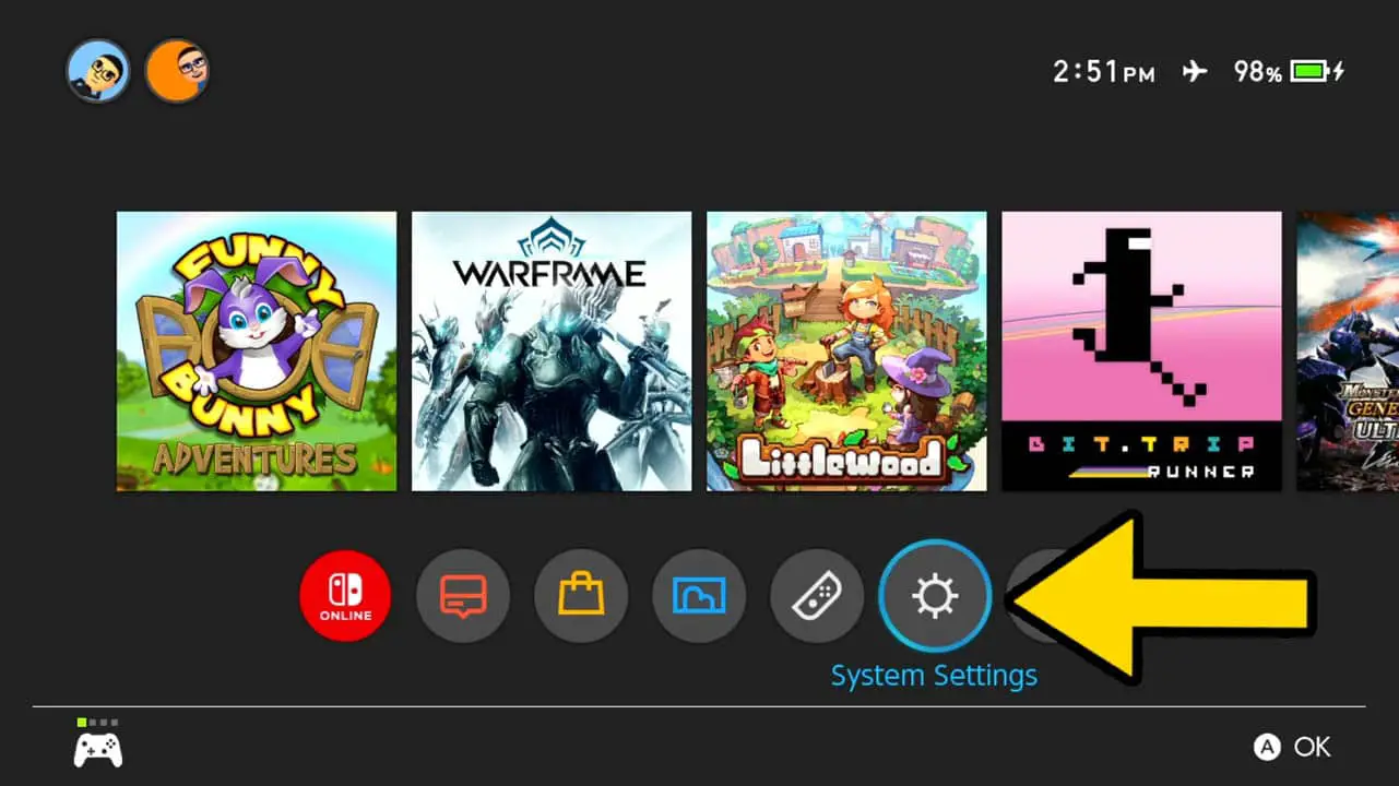 Switch HOME Menu with a row of game icons and a row of icons before the game icons; a yellow arrow pointing at the cog wheel icon