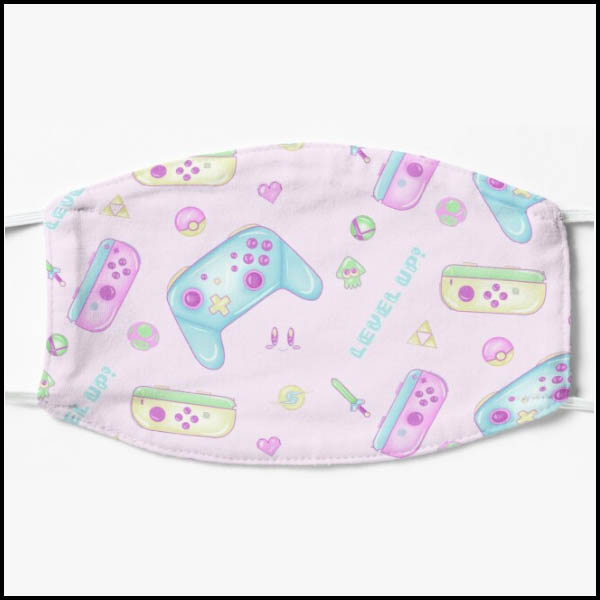 A face mask; pink with Switch controller art, kirby face art, and various Nintendo related art