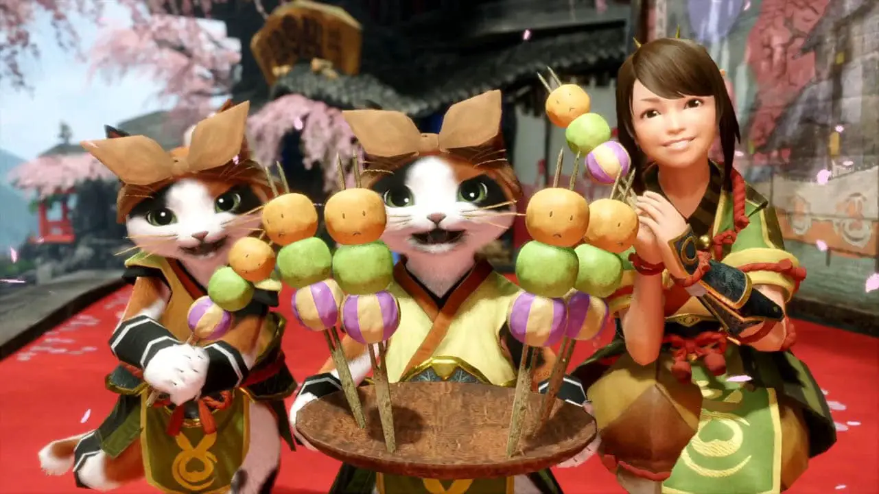 A happy cat holding food next to a smiling cat and girl