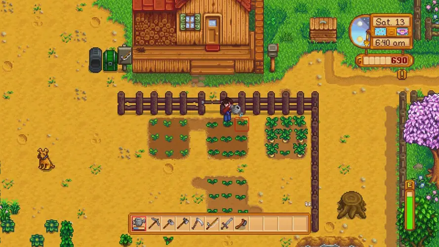 Farmland with man tending to crops next to his home from above (stardew valley screenshot)