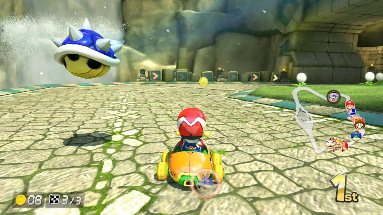 A guy in a kart racing on a trak with a blue spike shell hovering overhead
