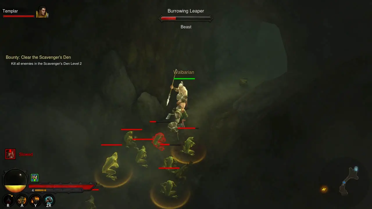 A man in a cave with a spear in his hand facing a group of monsters
