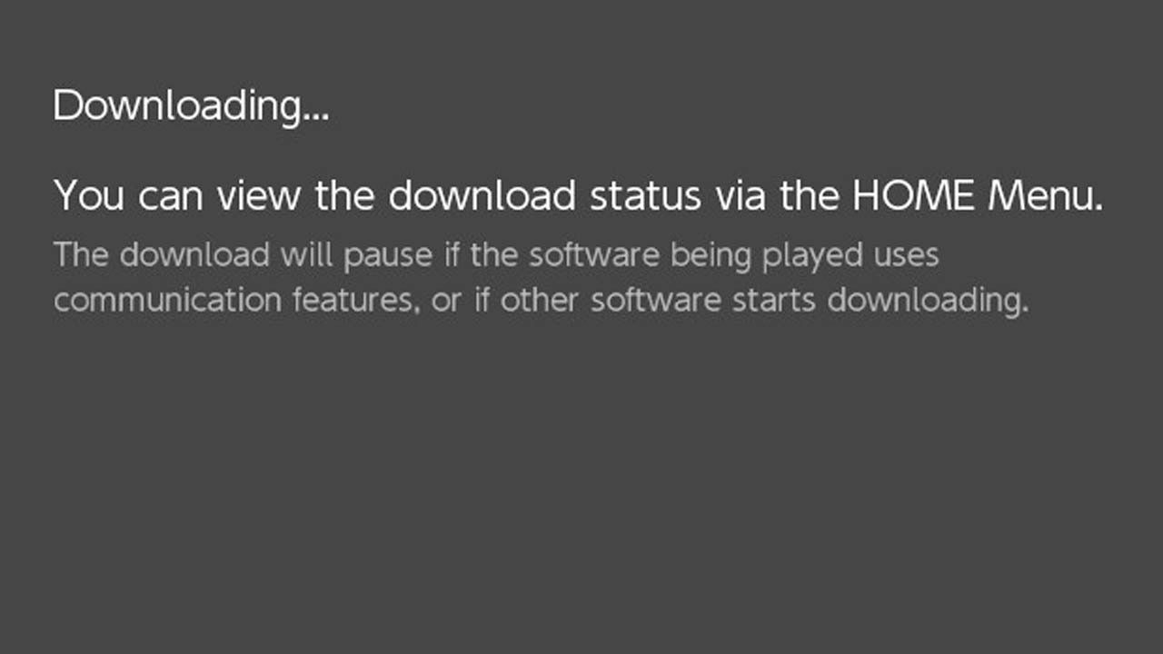A nintendo witch gray screen and a message saying an update is downloading