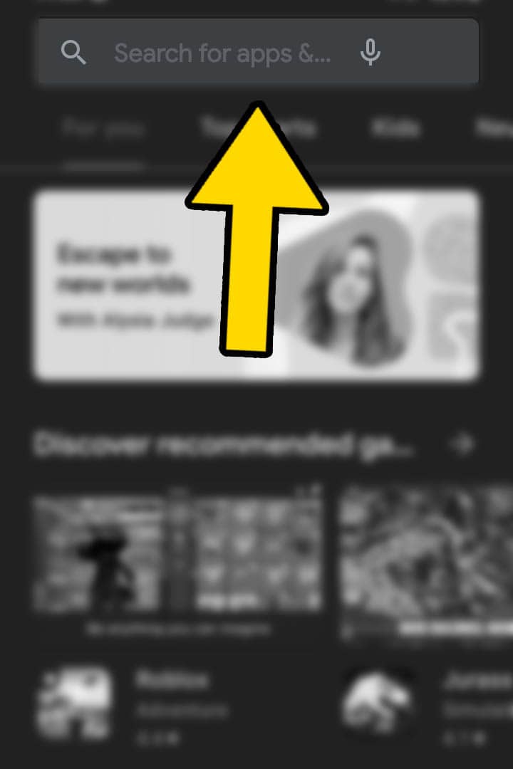 A blurred out goggle play store with a yellwo arrow pointing at the search bar
