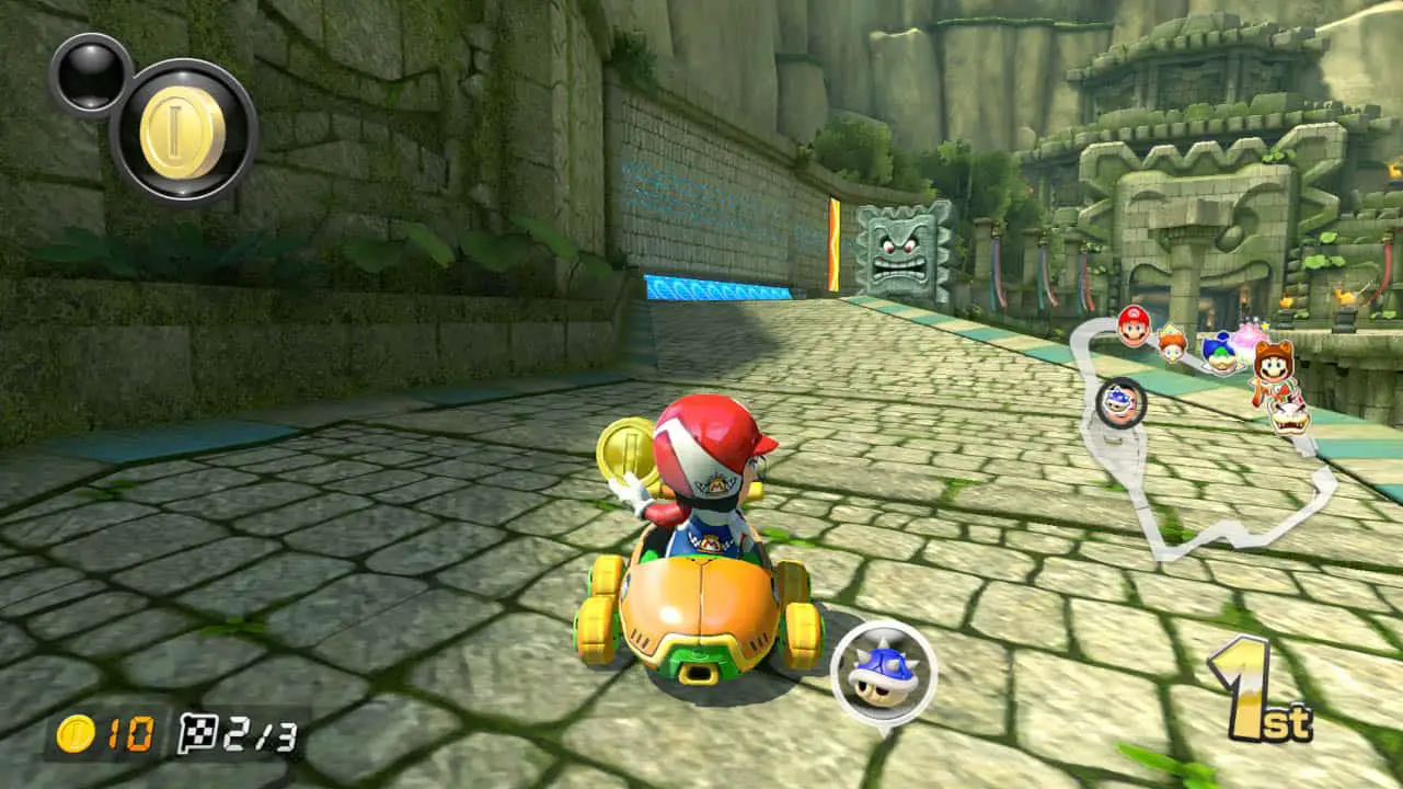 a person in a kart, holding a coin on brick road (mario kart 8 deluxe screenshot)