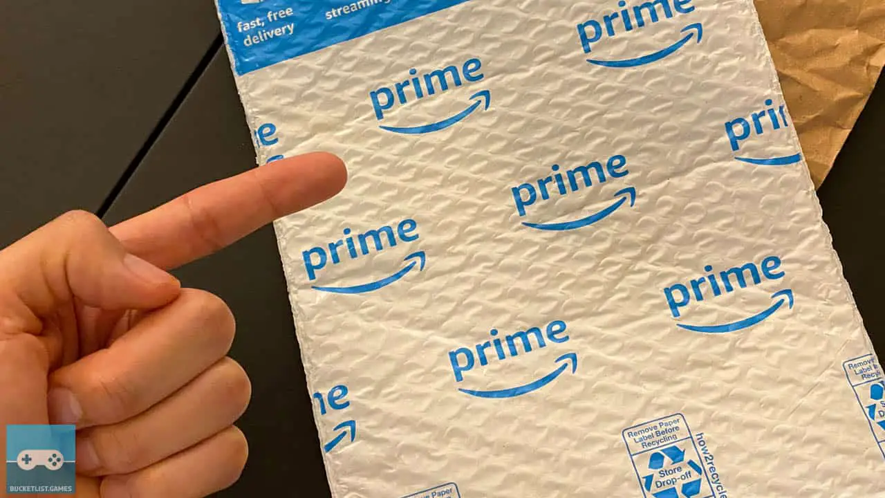 amazon packages on a table with a finger pointing at them