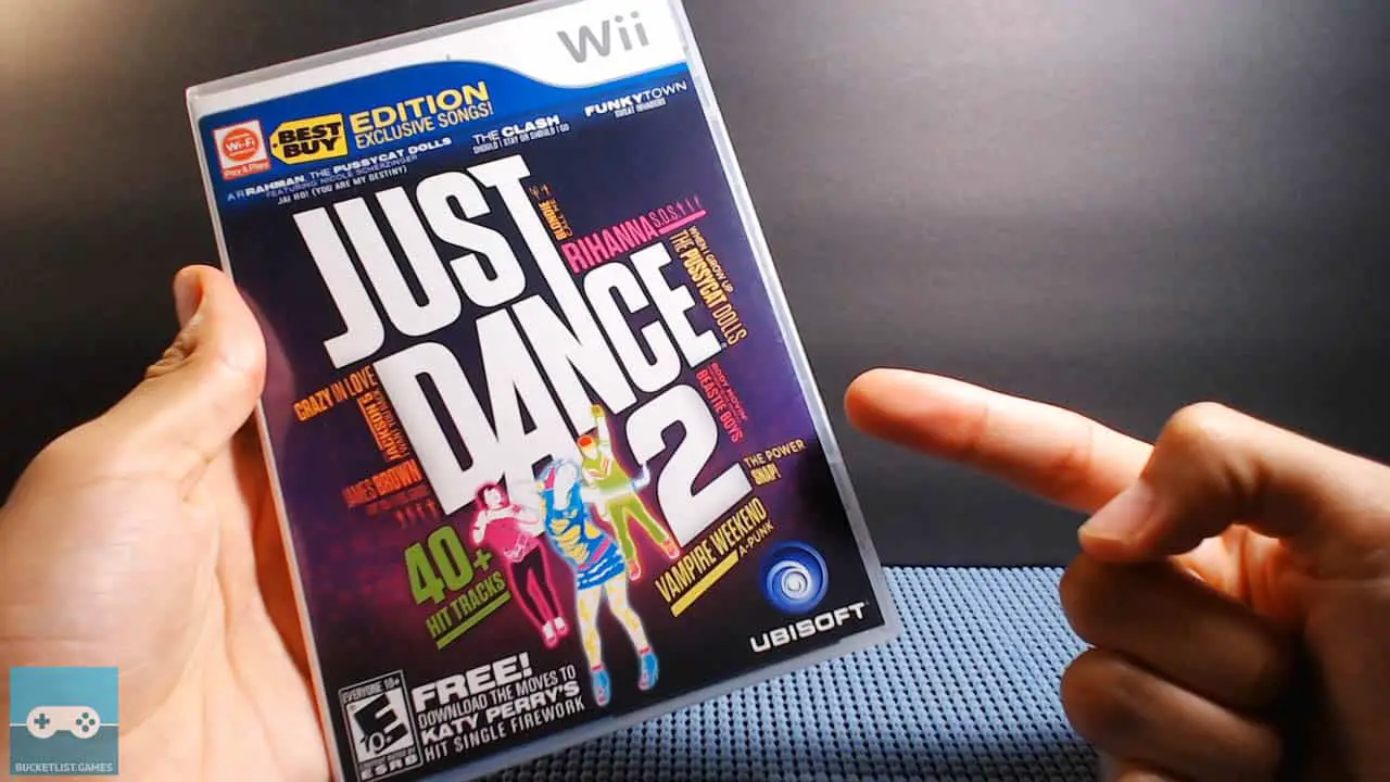 a pair of hands holding jsut dance 2 box for nintendo wii